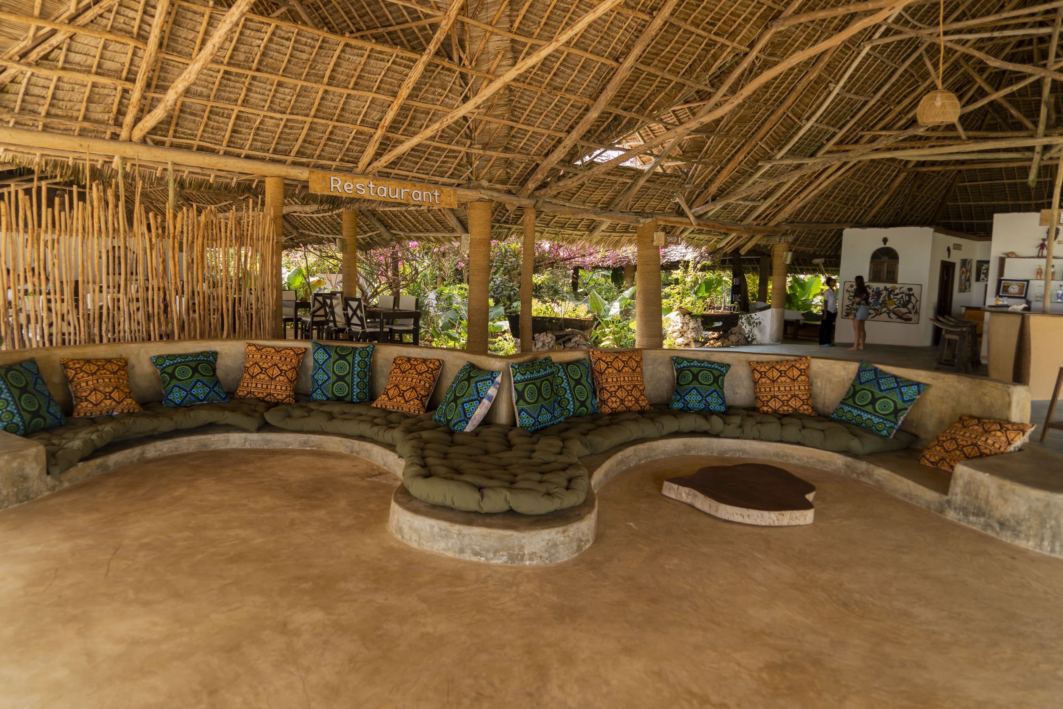 Thatched-roof restaurant and lounge seating at Veridiana Hotel Zanzibar