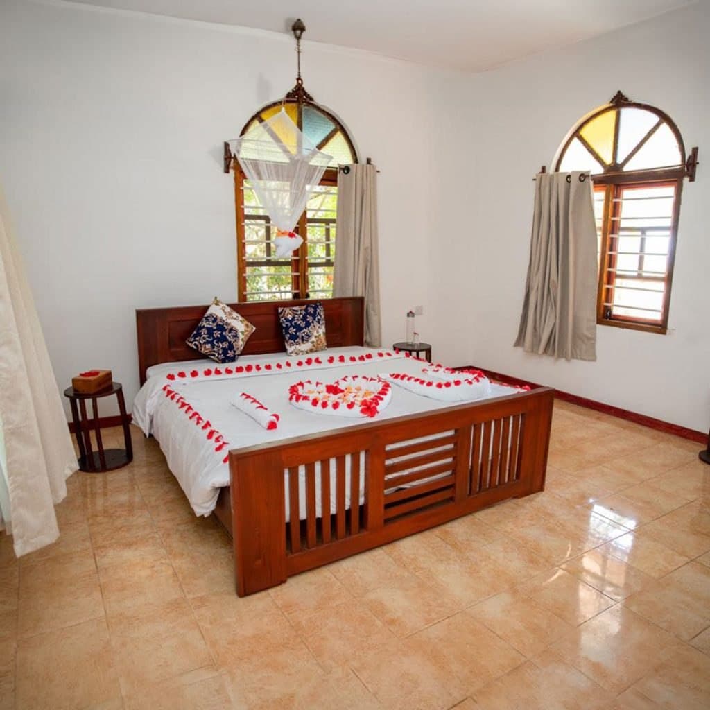 Ocean-front suite bedroom detail at Veridiana Hotel Zanzibar
